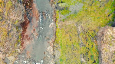 Aerial view of beautiful Stjornarfoss waterfall on a wet rainy day. clipart