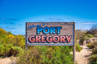 Port Gregory road sign along the Pink Lake, Western Australia. clipart