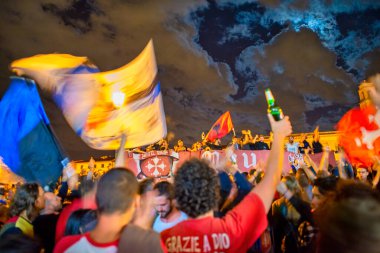 PISA, ITALY - JUNE 15TH, 2016: Local fans celebrate the soccer team's promotion. Celebrations in the night.