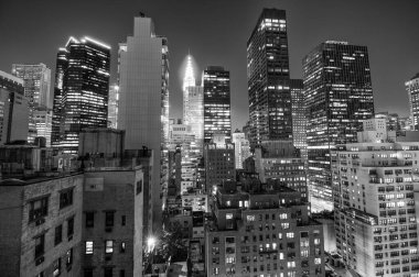 Manhattan Skyline at Sunset, Illuminating the Majestic Skyscrapers of New York. clipart