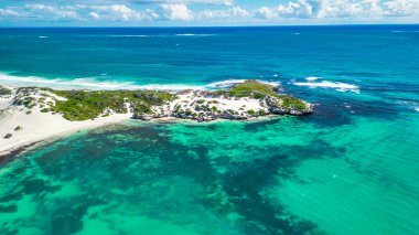 Jurien Bay's Sandy Cape Reserve from above: a serene escape with turquoise waters and sandy shores. clipart