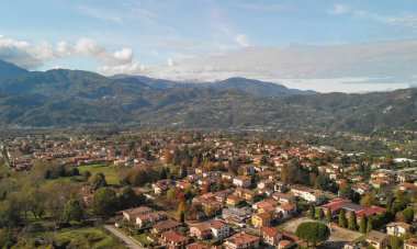 Aerial view of Barga, Garfagnana, showcasing the picturesque Italian village on a sunny day. clipart