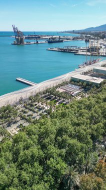 Panoramic aerial shot of Malaga showcasing its historic center and Mediterranean coast. clipart