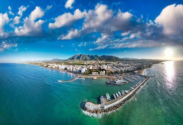 Breathtaking aerial view of Marbella, Spain, with its marina and golden sandy beaches.