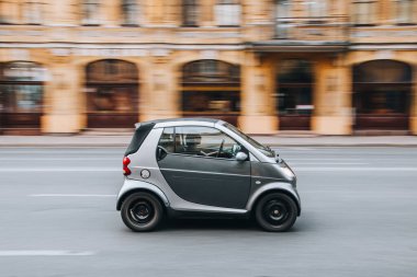 Ukraine, Kyiv - 2 August 2021: Black smart Fortwo car moving on the street. Editorial clipart