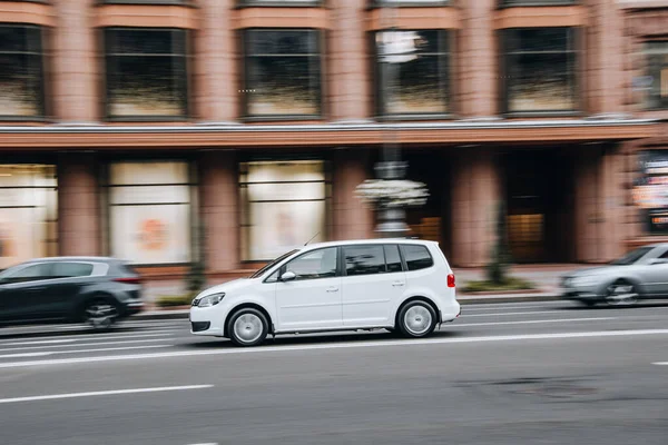 stock image Ukraine, Kyiv - 2 August 2021: White Volkswagen Touran car moving on the street. Editorial