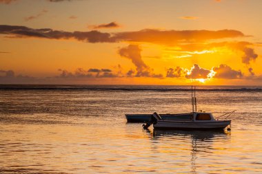 Sunset on the beach of Albion. Albion beach is amongst the most picturesque beaches in Mauritius. Located on the west coast of it is also home to the iconic Lighthouse of Albion.