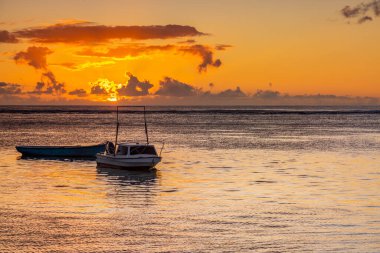Sunset on the beach of Albion. Albion beach is amongst the most picturesque beaches in Mauritius. Located on the west coast of it is also home to the iconic Lighthouse of Albion.