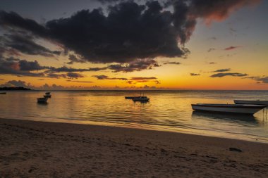 Sunset on the beach of Albion. Albion beach is amongst the most picturesque beaches in Mauritius. Located on the west coast of it is also home to the iconic Lighthouse of Albion.