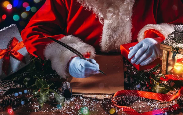 Santa Claus Writes Letter Good Wishes Xmas Gifts — Stock Photo, Image