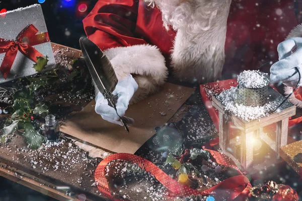 Santa Claus Writes Letter Good Wishes Xmas Gifts — Stock Photo, Image