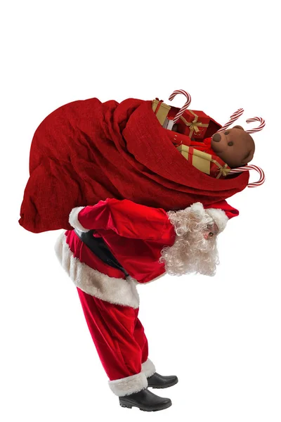 Święty Mikołaj Niesie Wielki Worek Pełen Prezentów Świątecznych — Zdjęcie stockowe