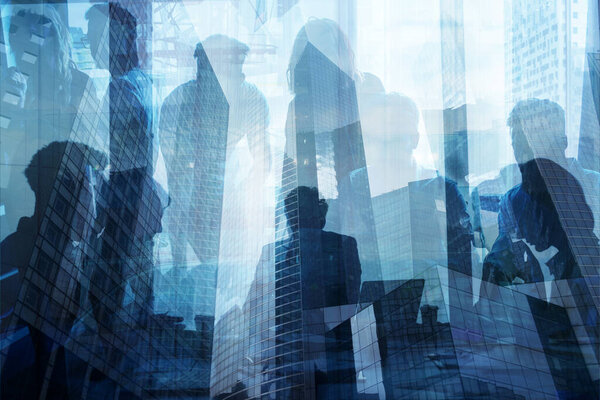 Double exposure of business people who work together in office