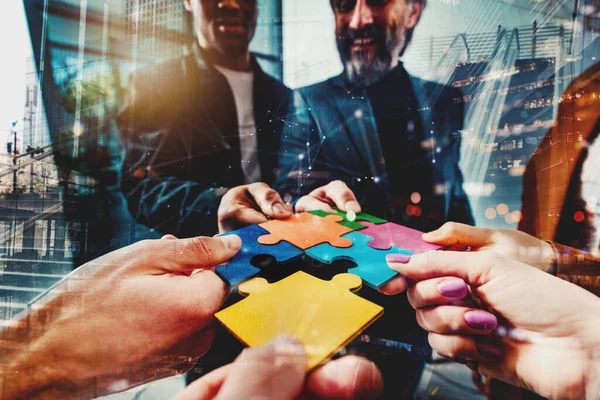 Business people connect puzzle pieces as integration and startup