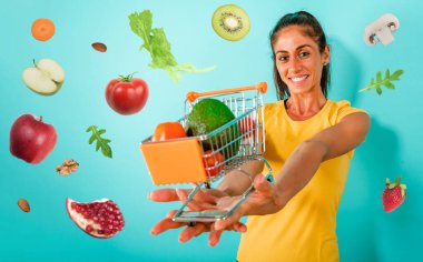 Happy woman made an healthy shopping of fresh fruit clipart