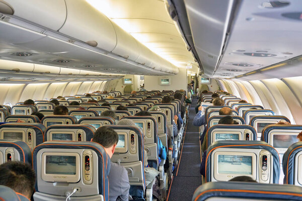 ГОНКОНГ - CIRCA DECEMBER, 2019: съемка салона самолета Boeing 777-300ER.