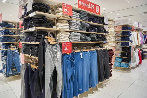 stock image SHENZHEN, CHINA - CIRCA NOVEMBER, 2019: apparel on display at Uniqlo store in Shenzhen. Uniqlo is a Japanese casual wear designer, manufacturer and retailer.