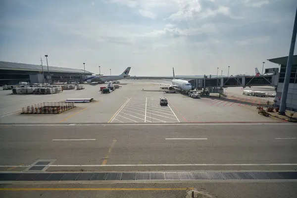 stock image KUALA LUMPUR, MALAYSIA - CIRCA JANUARY, 2020: SilkAir Boeing 737 on tarmac seen from Kuala Lumpur International Airport Satellite Terminal Building.