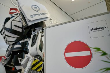 COLOGNE, GERMANY - CIRCA SEPTEMBER, 2018: Gamesbot robot, mascot of Gamescom as seen during Photokina Exhibition. Gamescom is trade fair for computer and video games held annually at the Koelnmesse. clipart