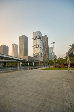 SHENZHEN, CHINA - 27 NOVEMBER, 2019: Shenzhen urban landscape during civil twilight. clipart