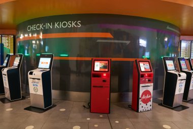 KUALA LUMPUR, MALAYSIA - CIRCA MARCH, 2023: self check-in kiosks as seen in Kuala Lumpur International Airport. clipart