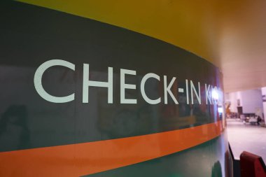 KUALA LUMPUR, MALAYSIA - CIRCA MARCH, 2023: close up shot of check-in kiosks sign seen in Kuala Lumpur International Airport. clipart