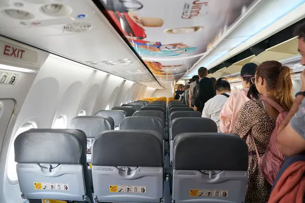 stock image CHIANG MAI, THAILAND - CIRCA APRIL, 2023: passengers standing in the aisle at Nok Air Boeing 737-800 after landing.