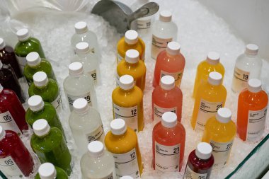 BANGKOK, THAILAND - CIRCA APRIL, 2023: bottles with chilled fresh juice on display at Tops Food Hall premium-level supermarket in CentralWorld shopping center in Bangkok.  clipart