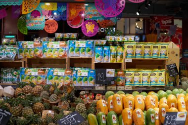 BANGKOK, THAILAND - CIRCA APRIL, 2023: various tropical fruits on display at Tops Food Hall premium-level supermarket in CentralWorld shopping center in Bangkok.  clipart