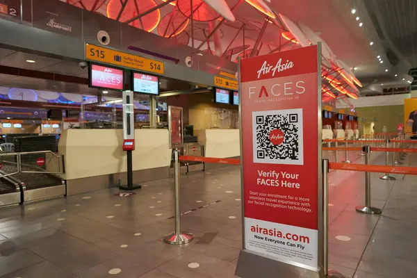 stock image KUALA LUMPUR, MALAYSIA - CIRCA MARCH, 2023: AirAsia check-in area in Kuala Lumpur International Airport.