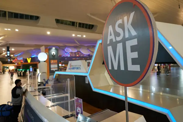 stock image KUALA LUMPUR, MALAYSIA - CIRCA MARCH, 2023: Ask Me sign as seen at information counter in KLIA2 main lobby.