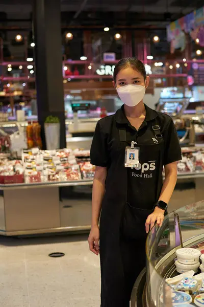 stock image BANGKOK, THAILAND - CIRCA APRIL, 2023: indoor portrait of employee at Tops Food Hall premium-level supermarket in CentralWorld shopping center in Bangkok. 