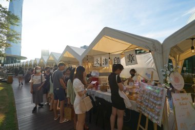 KUALA LUMPUR, MALAYSIA - CIRCA MAY, 2023: pop-up market in the Central Rooftop Garden located at Level 4 of Mitsui Shopping Park LaLaport BBCC. clipart