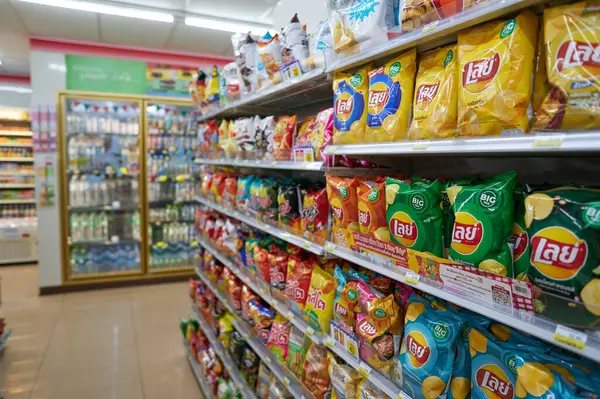 stock image PHUKET, THAILAND - APRIL 15, 2023: potato chips Lay's on display inside 7-Eleven convenience store in Phuket.