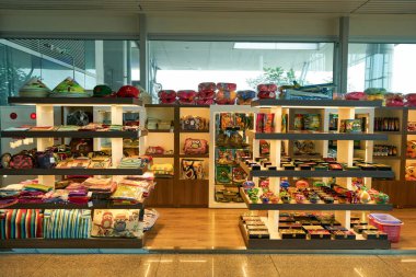 HO CHI MINH CITY, VIETNAM - MARCH 30, 2023: goods on display in store at landside zone inside Tan Son Nhat International Airport. clipart