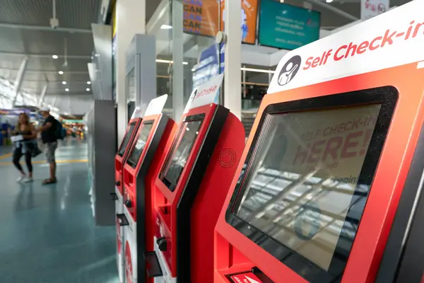 stock image PHUKET, THAILAND - MAY 09, 2023: AirAsia self check-in kiosks inside Phuket International Airport.