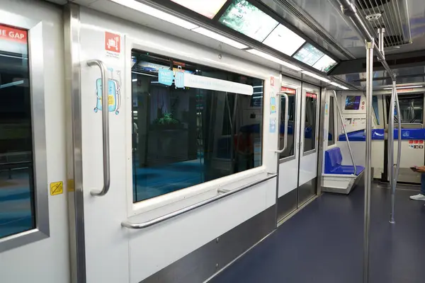 stock image SINGAPORE - NOVEMBER 06, 2023: interior of a Mitsubishi Crystal Mover Skytrain car at Singapore Changi Airport.