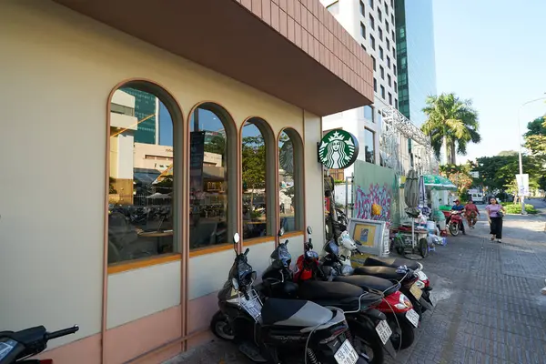 stock image HO CHI MINH CITY, VIETNAM - MARCH 26, 2023: scooters parked at Starbucks Coffee in Ho Chi Minh City.