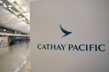 HONG KONG, CHINA - DECEMBER 04, 2023: close up shot of Cathay Pacific sign as seen inside Hong Kong International Airport. clipart