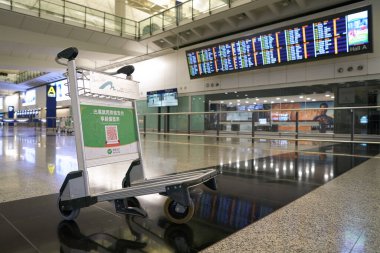 HONG KONG, CHINA - DECEMBER 04, 2023: baggage cart as seen at arrivals hall A inside Hong Kong International Airport. clipart