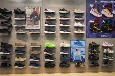 SINGAPORE - NOVEMBER 06, 2023: interior shot of Skechers store inside Paragon Shopping Mall in Singapore. Skechers USA, Inc. is an American multinational footwear company. clipart