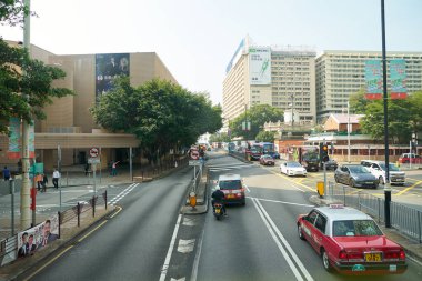 HONG KONG, CHINA - DECEMBER 05, 2023: Tsim Sha Tsui urban landscape as seen from upper deck of a double-decker bus in Hong Kong. clipart