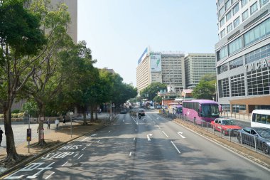 HONG KONG, CHINA - DECEMBER 05, 2023: Tsim Sha Tsui urban landscape as seen from upper deck of a double-decker bus in Hong Kong. clipart