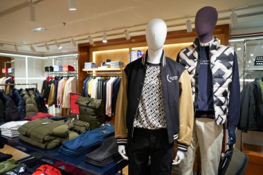 HONG KONG, CHINA - DECEMBER 05, 2023: interior shot of Tommy Hilfiger store inside Harbour City. Harbour City is a shopping centre in Tsim Sha Tsui, Kowloon.