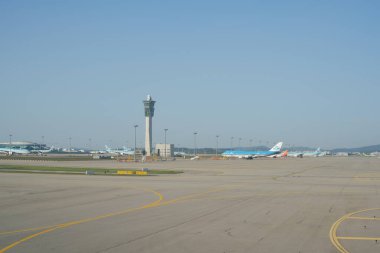 INCHEON, SOUTH KOREA - JUNE 03, 2017: airliners on tarmac at Incheon International Airport, the main international airport serving Seoul. clipart