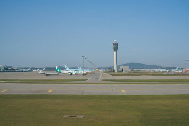 INCHEON, SOUTH KOREA - JUNE 03, 2017: airliners on tarmac at Incheon International Airport, the main international airport serving Seoul. clipart