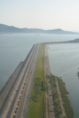 INCHEON, SOUTH KOREA - JUNE 03, 2017: aerial view from an aircraft during landing at Incheon International Airport. clipart