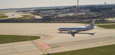 CHICAGO, IL - APRIL 05, 2016: American Airlines Boeing 737-800 taxiing in Chicago O'Hare International Airport. O'Hare is a major international airport serving Chicago. clipart