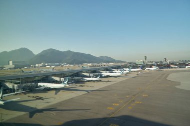 HONG KONG, CHINA - DECEMBER 08, 2023: Cathay Pacific aircrafts on tarmac at Hong Kong International Airport. clipart