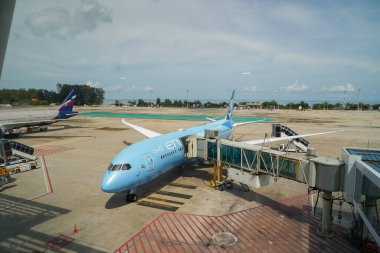 PHUKET, THAILAND - MAY 09, 2023: Etihad Airways Boeing 787-9 Dreamliner on tarmac in Phuket International Airport. clipart